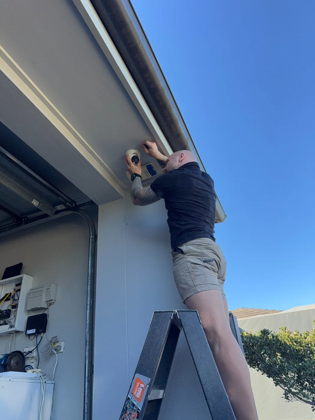 Soter Group director installing a CCTV camera on site